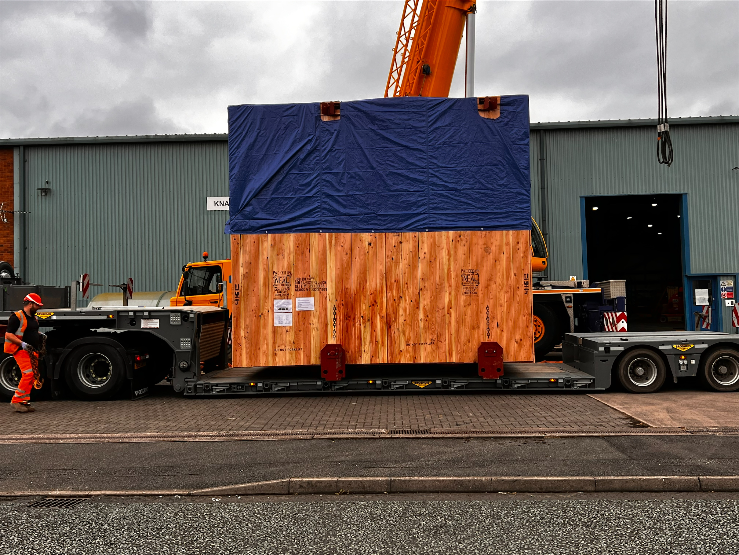 Custom crate for machine on trailer of the lorry.