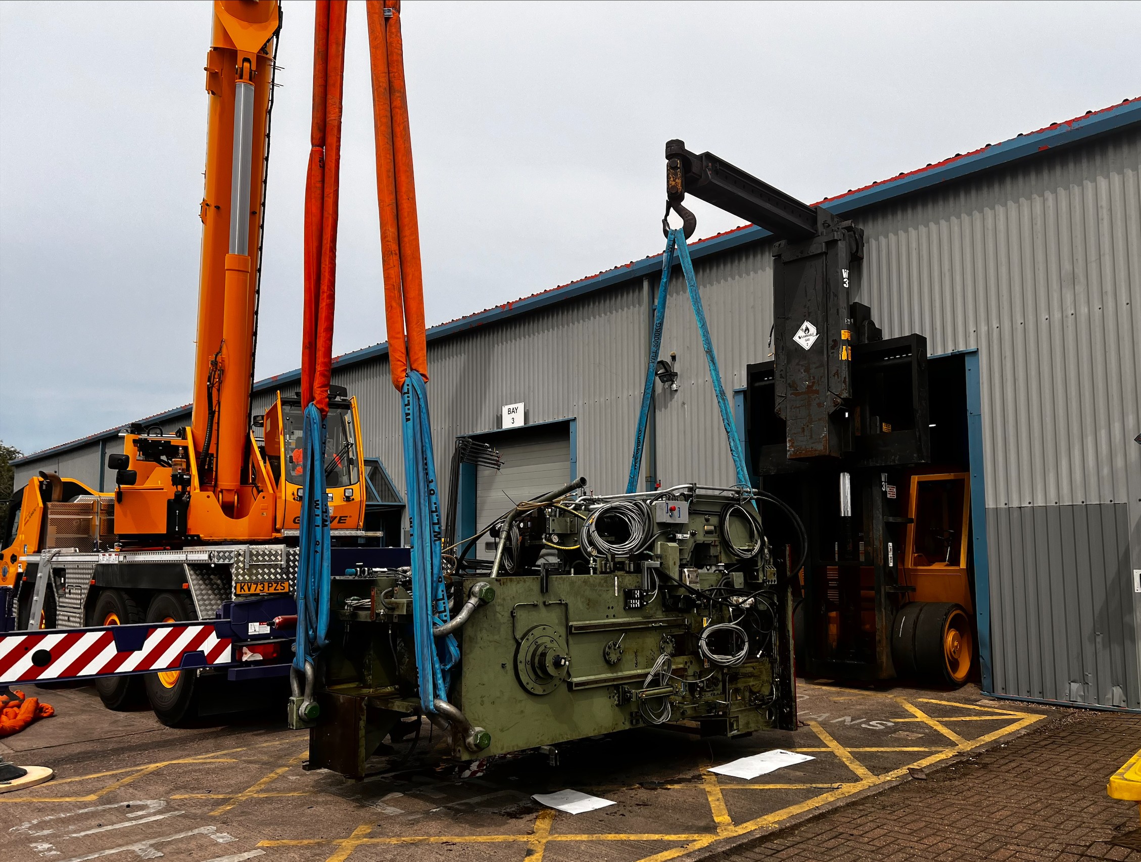 Machine lift by Hoist and crane.